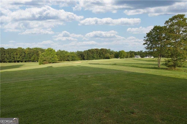 surrounding community featuring a lawn