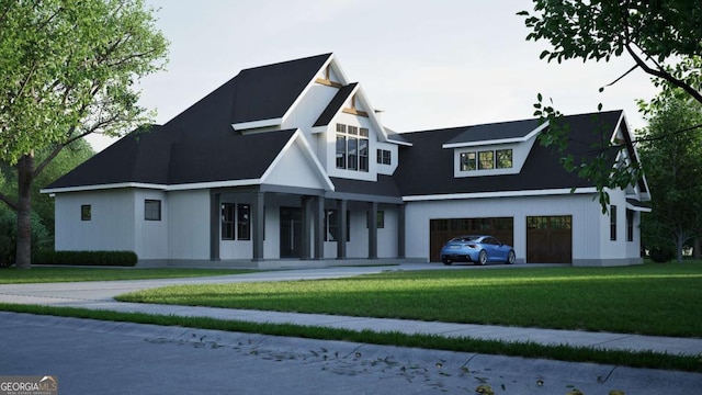 view of front of home with a garage and a front lawn