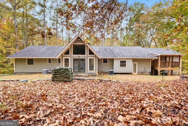 rear view of property with central air condition unit