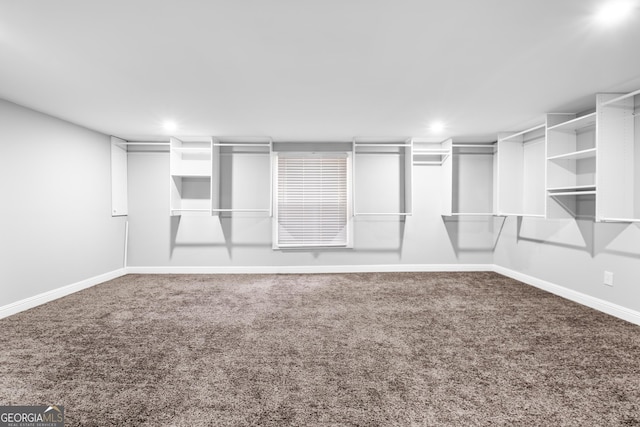 walk in closet featuring carpet