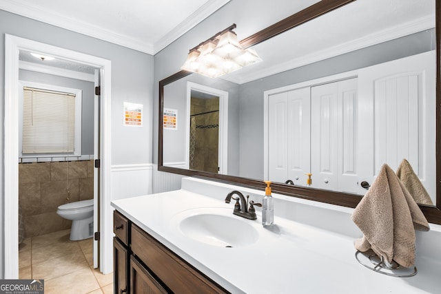 bathroom featuring crown molding, tile patterned flooring, vanity, and toilet