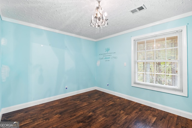 unfurnished room with hardwood / wood-style floors, crown molding, a textured ceiling, and a chandelier