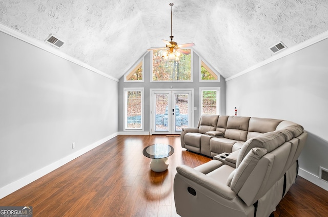 living room with lofted ceiling, dark wood-type flooring, french doors, crown molding, and ceiling fan