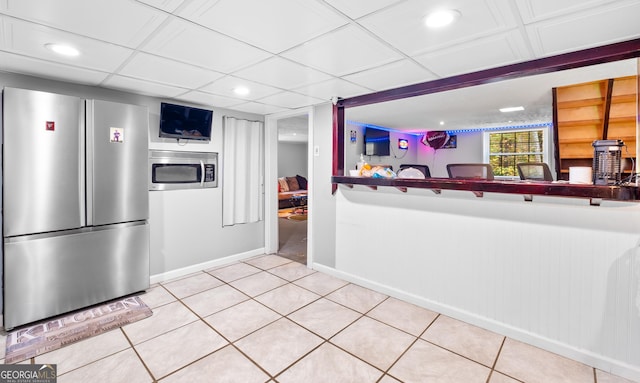 kitchen featuring tile patterned floors and appliances with stainless steel finishes