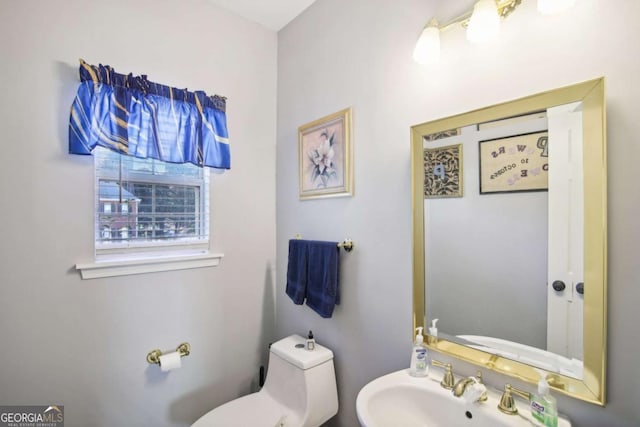 bathroom featuring sink and toilet