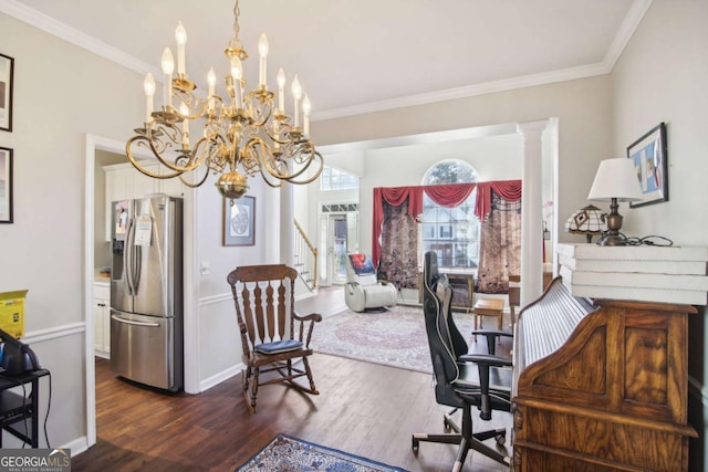 office area featuring an inviting chandelier, crown molding, dark wood-type flooring, and decorative columns