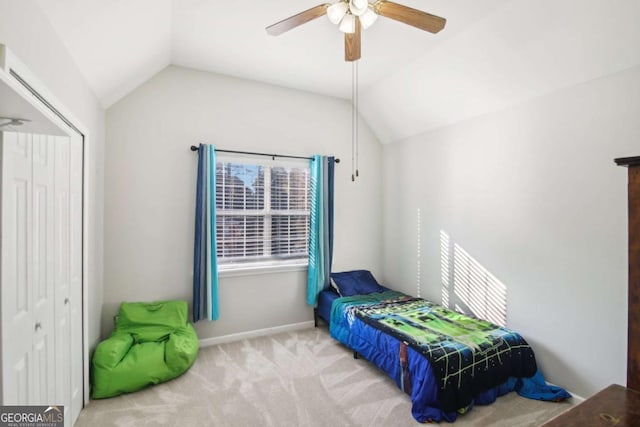 bedroom with ceiling fan, light carpet, and lofted ceiling