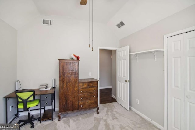 office space featuring light carpet, vaulted ceiling, and ceiling fan