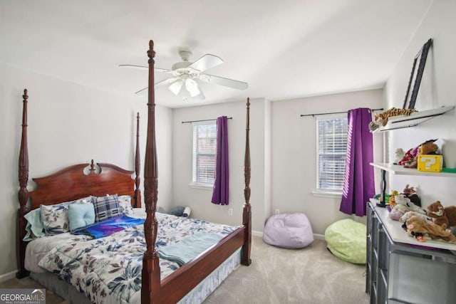 carpeted bedroom with ceiling fan