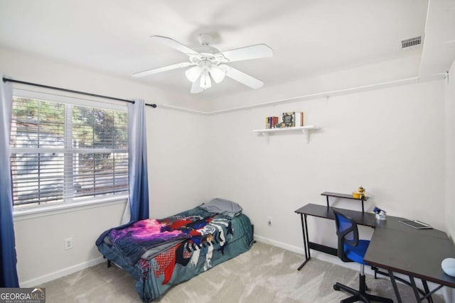 bedroom featuring ceiling fan and light colored carpet