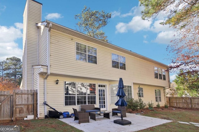 rear view of property featuring a patio