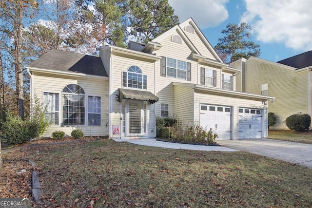 view of front facade with a garage and a front lawn