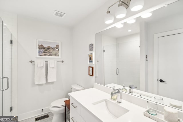 bathroom featuring vanity, toilet, and walk in shower