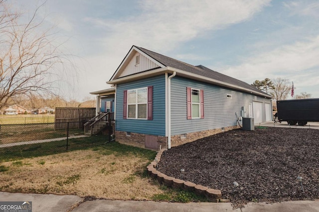 view of property exterior featuring a yard and central air condition unit