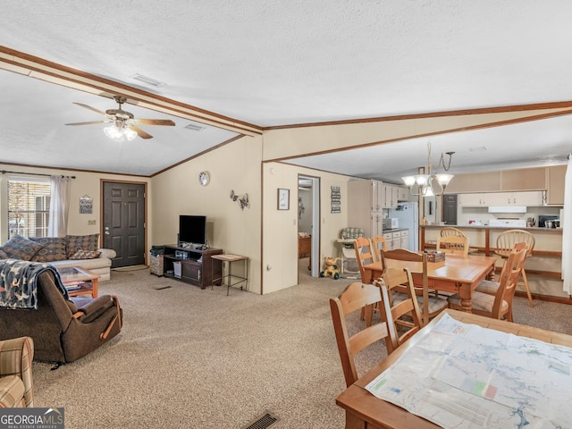 interior space with a textured ceiling, light carpet, ceiling fan with notable chandelier, and vaulted ceiling