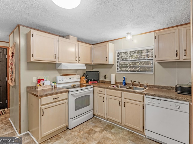 kitchen featuring a textured ceiling, sink, and white appliances