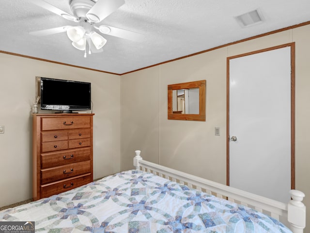 bedroom with ceiling fan and crown molding