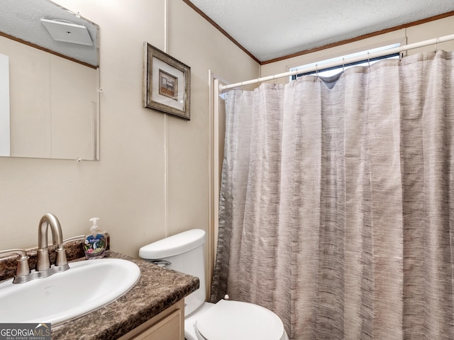 bathroom with vanity, a shower with curtain, toilet, ornamental molding, and a textured ceiling