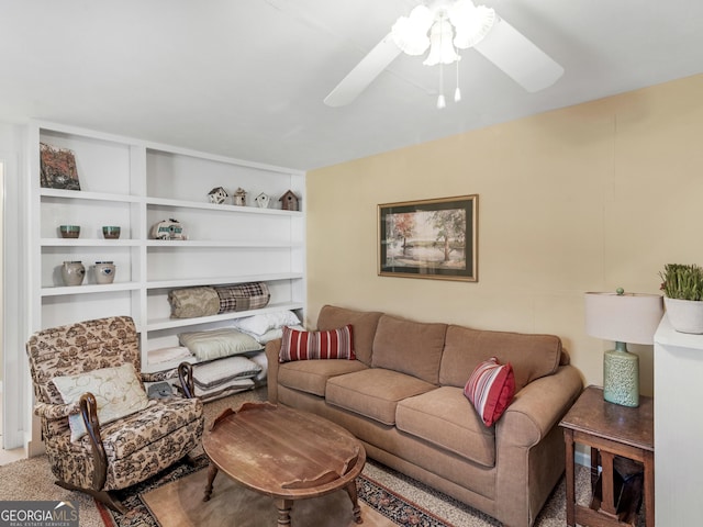 living room with carpet floors and ceiling fan