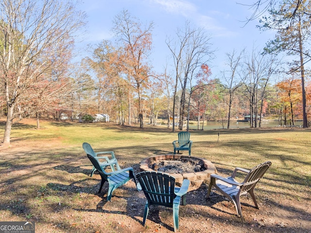 view of yard with a fire pit