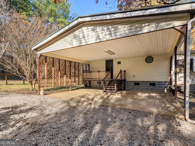 view of front of property featuring a carport