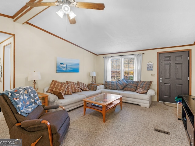 living room with carpet, vaulted ceiling, ceiling fan, and crown molding