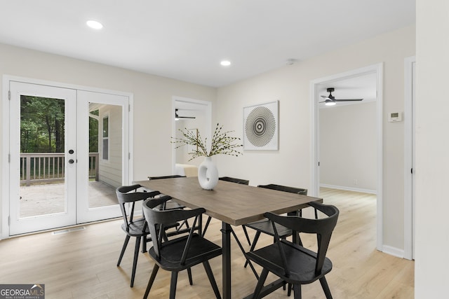 dining space with ceiling fan, light wood-type flooring, and french doors