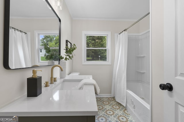 bathroom featuring a wealth of natural light, sink, crown molding, and shower / bath combo