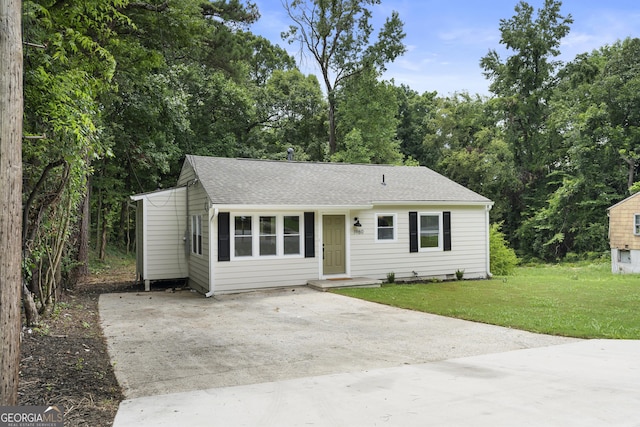 ranch-style house with a front lawn