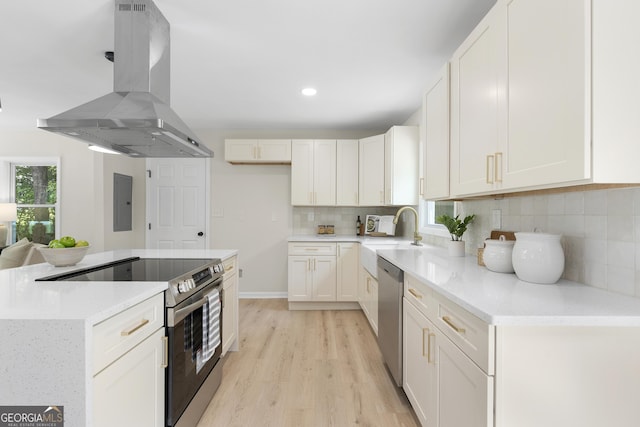 kitchen featuring stainless steel appliances, sink, white cabinets, and exhaust hood