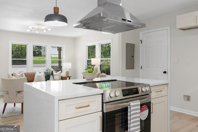 kitchen featuring stainless steel range with electric cooktop, electric panel, ventilation hood, light hardwood / wood-style floors, and white cabinetry