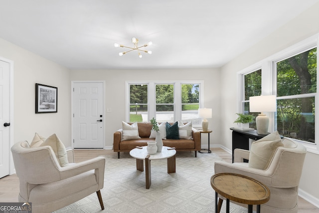 interior space featuring a chandelier and light hardwood / wood-style floors