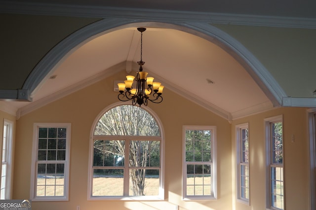 interior details with an inviting chandelier and ornamental molding