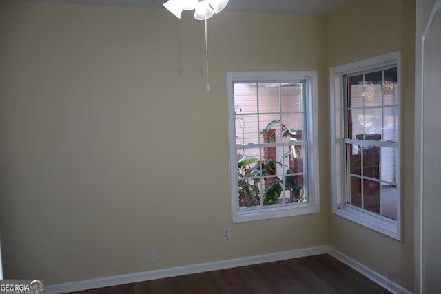 unfurnished dining area featuring dark wood-type flooring