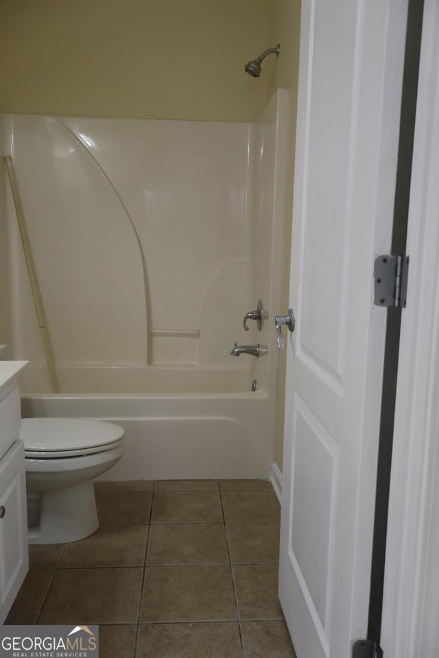 full bathroom featuring tile patterned flooring, vanity, toilet, and shower / bath combination