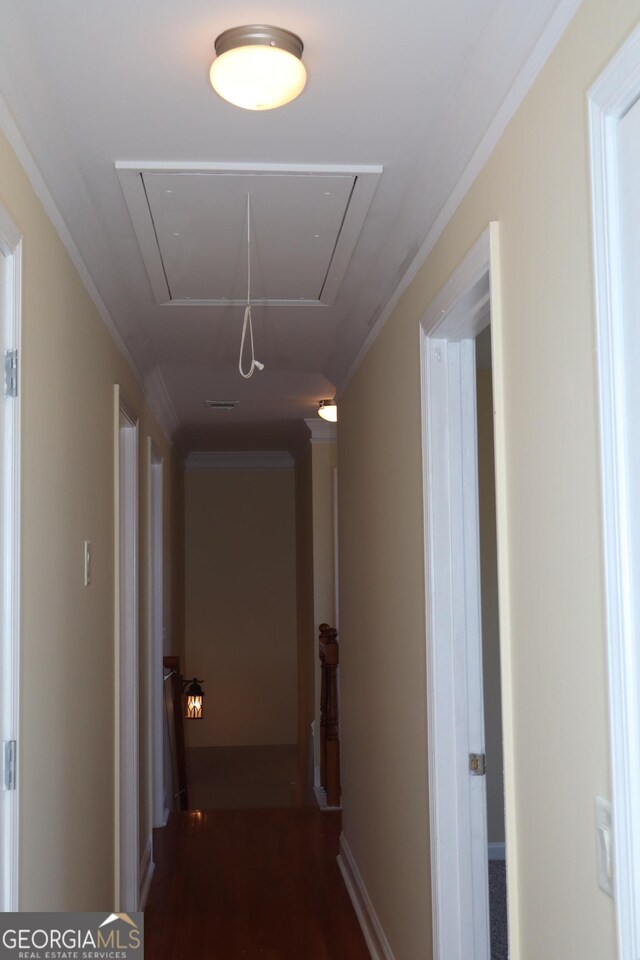 hallway featuring crown molding