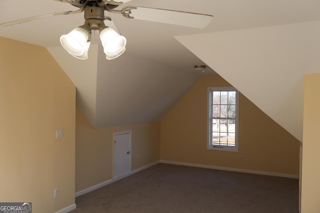 additional living space featuring carpet floors, ceiling fan, and lofted ceiling