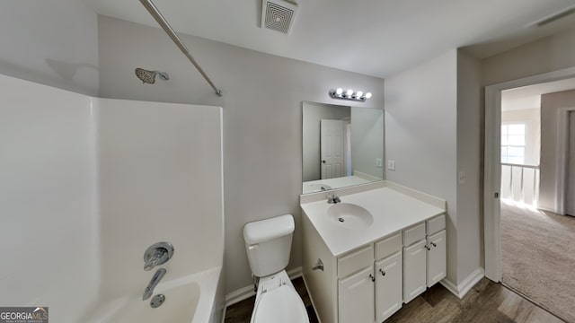 full bathroom with vanity, toilet, wood-type flooring, and shower / washtub combination