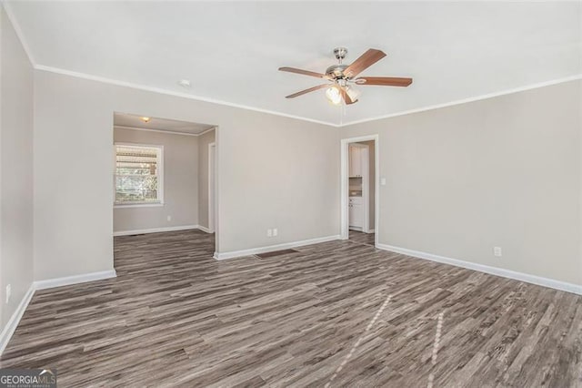 unfurnished room with ceiling fan, dark wood-type flooring, and ornamental molding