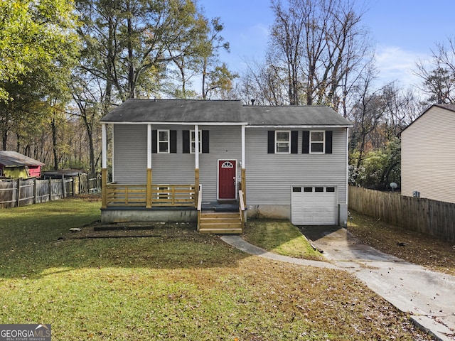 bi-level home with a front yard and a garage