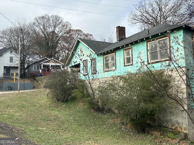 view of property exterior featuring a yard