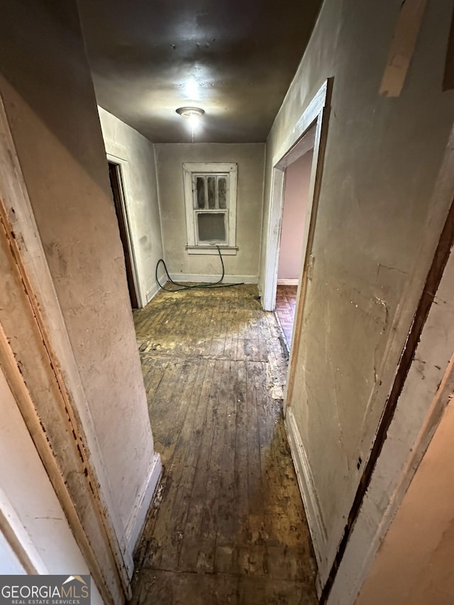 corridor featuring dark wood-type flooring