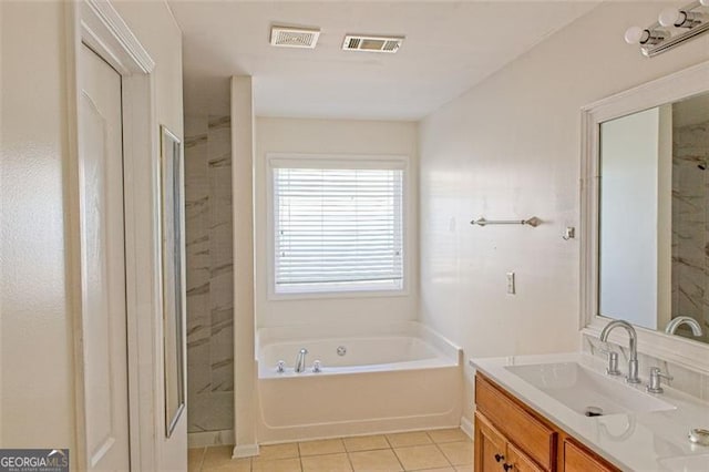 bathroom featuring tile patterned floors, separate shower and tub, and vanity