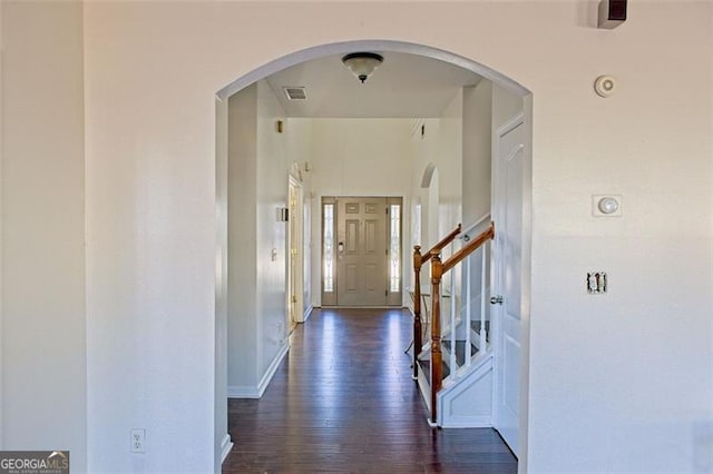 hallway with dark hardwood / wood-style flooring