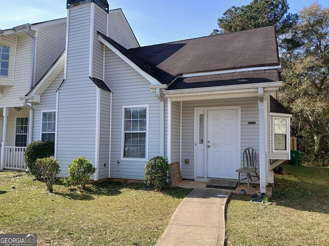 view of front of house with a front lawn