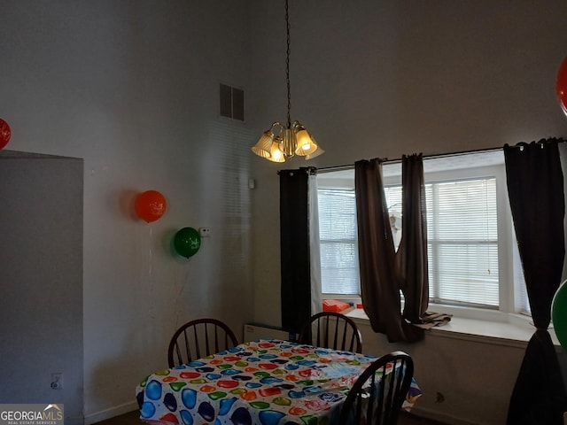 dining room featuring a notable chandelier