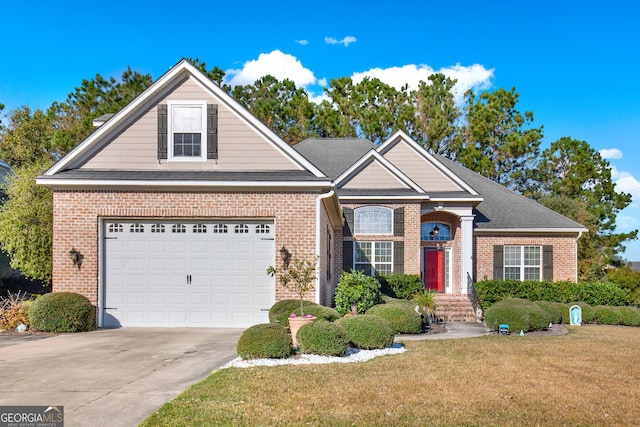 view of front of home with a front yard and a garage