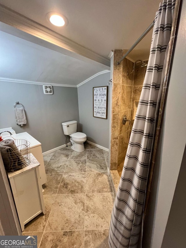 bathroom featuring a shower with curtain, toilet, and crown molding