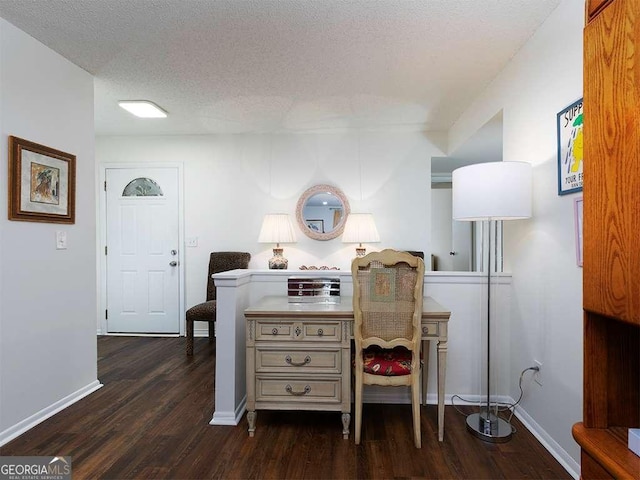 office space featuring a textured ceiling and dark hardwood / wood-style flooring