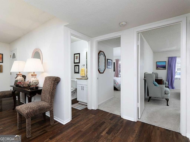 interior space featuring dark hardwood / wood-style flooring and a textured ceiling